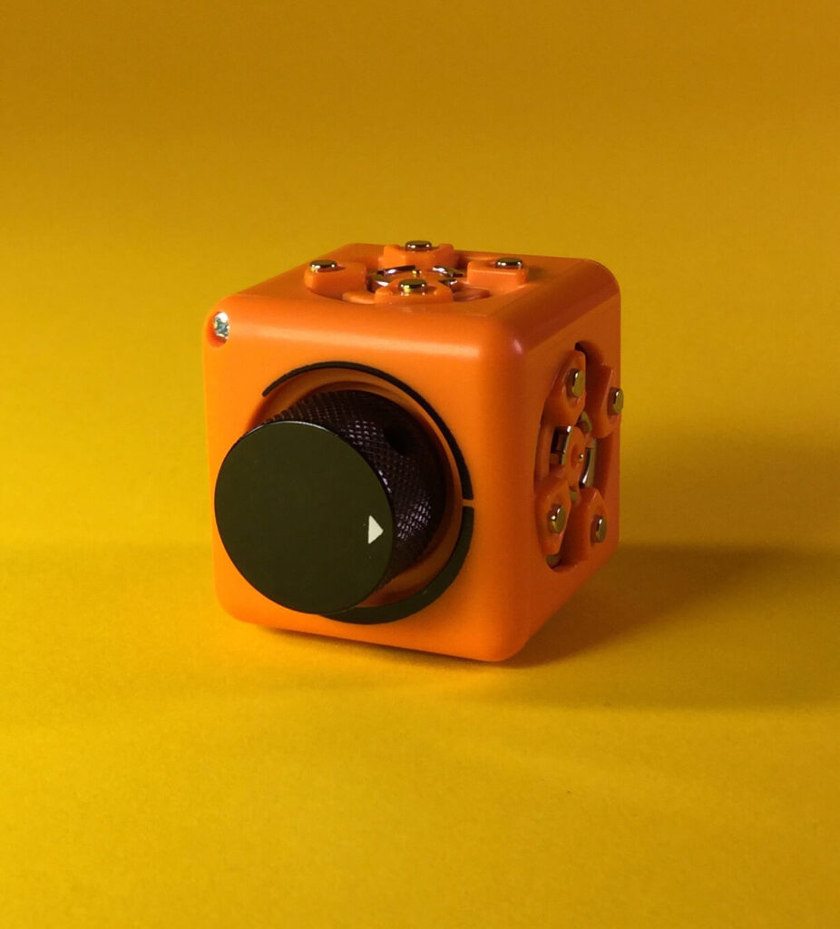 Just a Threshold Cubelet - Orange with a black knob for adjusting behavior (threshold) of block.
